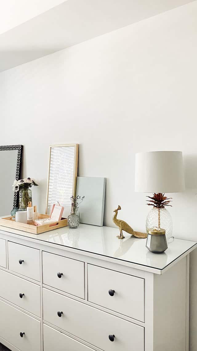 white cabinet with knobs